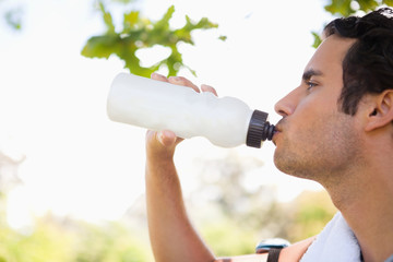 Man drinking from a sports bottle