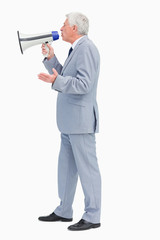 Profile of a businessman speaking with megaphone