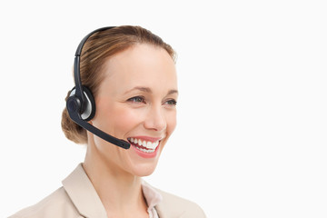 Woman in a suit with headset speaking