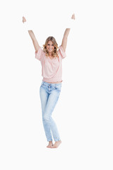 A smiling woman is holding up a white placard over her head