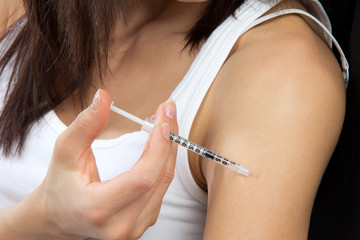Diabetes patient insulin flu shot by syringe with dose