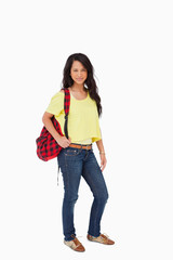 Pretty Latin student posing with a backpack