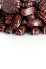 Many different chocolate candy isolated on white