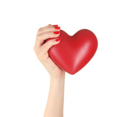 Fototapeta premium Red heart in woman's hand isolated on white