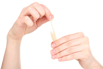 Hand throwing toothpick isolated on white