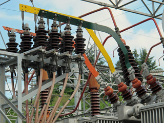 insulators and electrical cables and switches to an electric pow