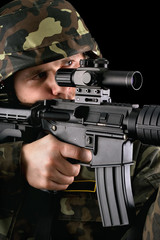 Armed soldier taking aim