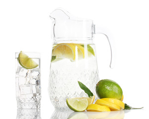 pitcher and glass of lemonade and lemon isolated on white