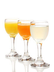 Tropical juices in glasses isolated on white