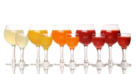 Tropical juices in glasses isolated on white