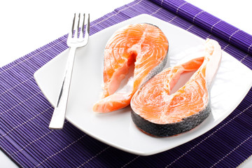 Raw salmon on dish