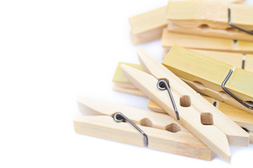 bamboo wooden clothespins on white background with copy space