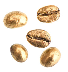 golden coffee beans isolated on white