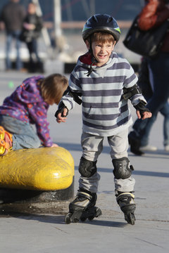 young boy on roller skates