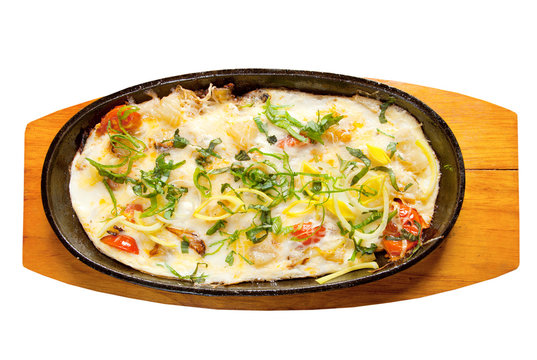 Fried eggs with vegetables and spring onions