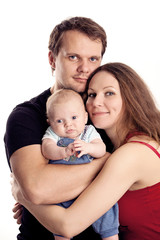 Portrait of a young caucasian couple with baby