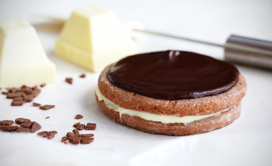 Decorating and icing layered chocolate biscuit