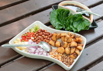 leaf wrapped bite size appetizer with fish