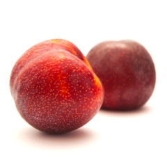 large red plum isolated on white background