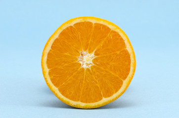 half orange fruit on azure background