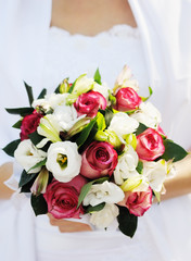 Bride holding beautiful wedding bouquet
