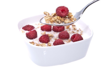 Muesli with fresh fruits on a spoon