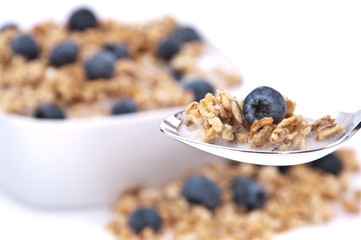 Muesli with blueberries on a spoon