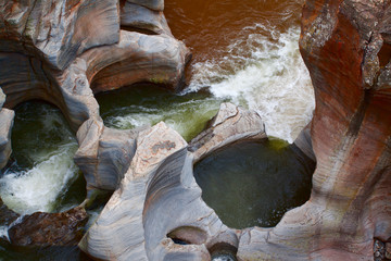 Wild water potholes in canyon