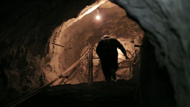 Miner ascending in mine