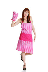 Young housewife in pink apron