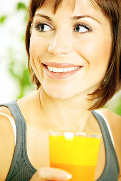 Healthy girl drinking orange juice