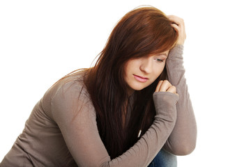 Fototapeta premium Teen girl in depression, isolated on white 