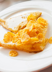 Bread topped with honey on a white dish