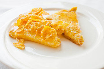 Bread topped with honey on a white dish