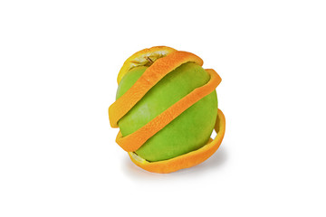 Green apple in orange peel