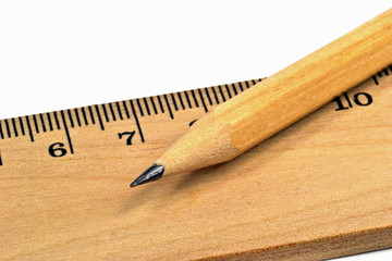 Macro image wooden pencil and ruler on white background