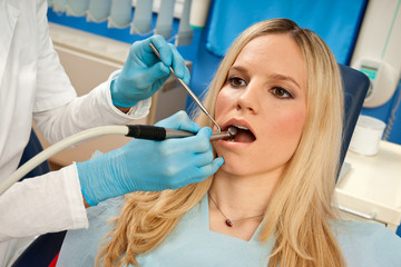 Fototapeta premium woman patient in dentist chair