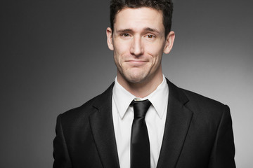 Handsome business man in white shirt and black suit.