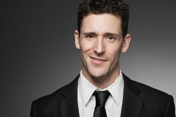 Handsome business man in white shirt and black suit.