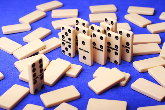 group of figures domino on blue background