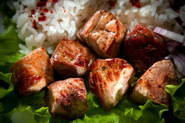 fried meat with rice and vegetables