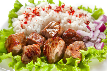 fried meat with rice and vegetables