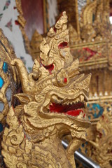 Fototapeta na wymiar The head of Naga stutue in front of The Buddhist church.