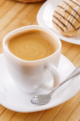 Coffee with cookie sandwich