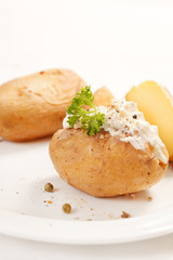Baked potato filled with soft cheese