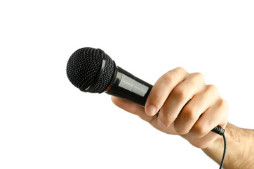 Hand holding microphone on white