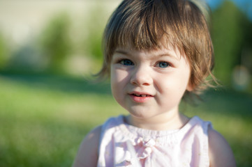 A little girl in a summer park