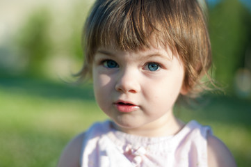 A little girl in a summer park