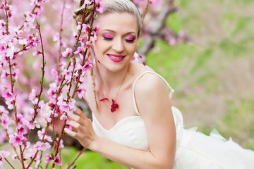 Fototapeta premium Bride in blossom garden