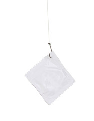 Condom on hook isolated on white